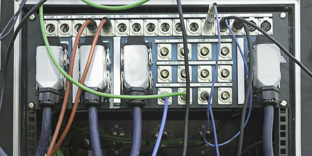 Complex electrical wiring and connections on a panel, demonstrating automated static bypass switch components within a UPS system.